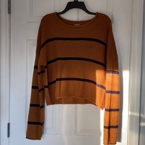 Orange sweater with navy blue stripes